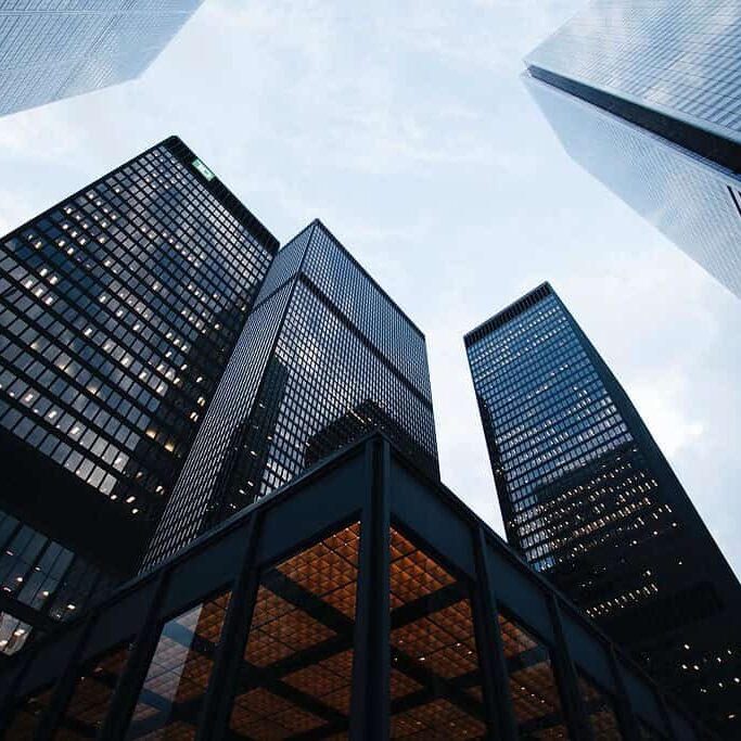 sean-pollock-PhYq704ffdA-unsplash a group of tall buildings